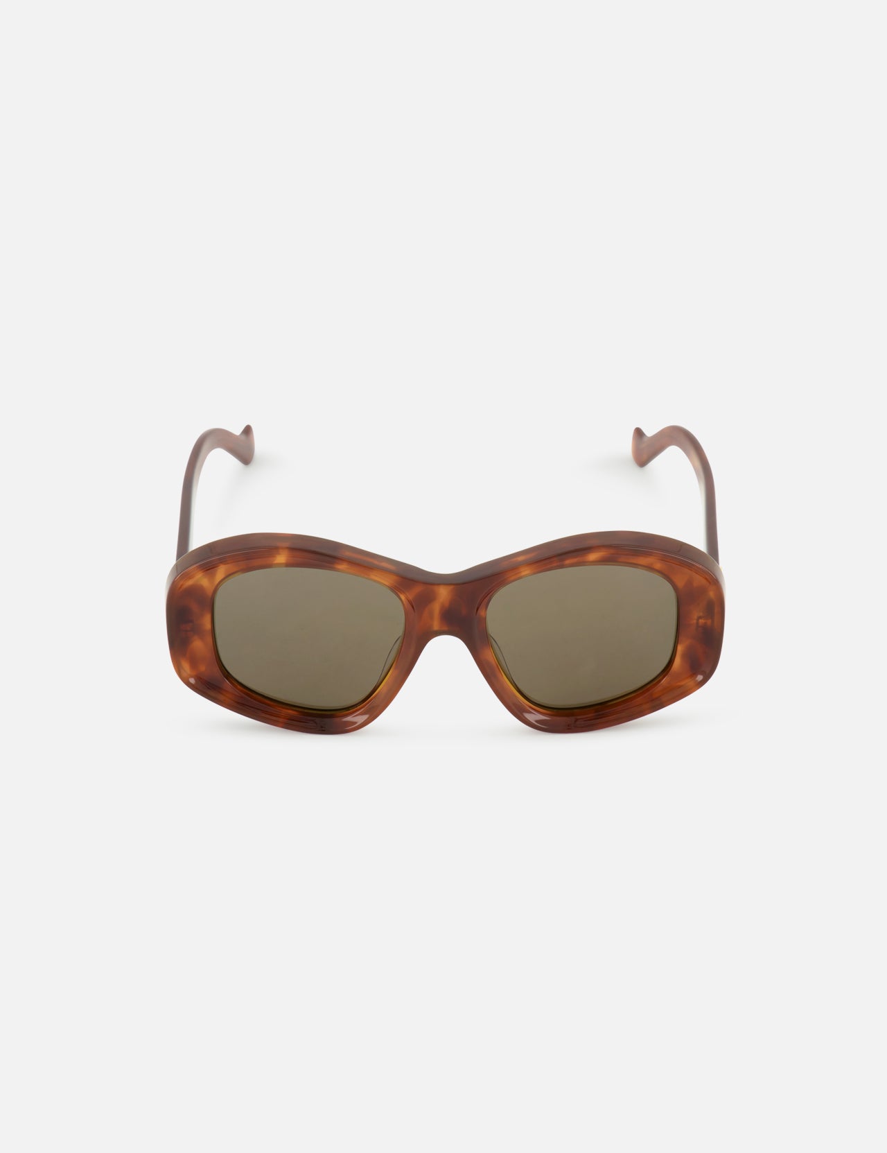 The LOEWE Oval Brown Tortoiseshell Sunglasses feature dark lenses and gently curved arms, combining luxury and timeless sophistication. Displayed on a plain white background, these sunglasses embody LOEWE’s iconic style.