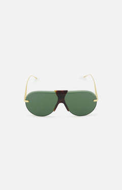 LOEWE Aviator Gold Sunglasses feature green lenses, gold wire arms, and a classic tortoiseshell bridge, shown against a white background.