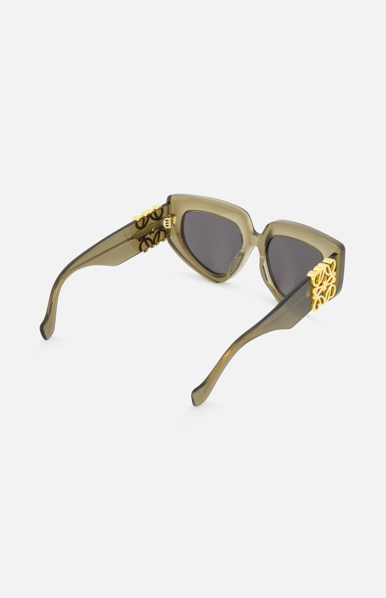 The LOEWE Cat Eye Taupe Sunglasses feature translucent olive green acetate cat-eye frames, thick temples with gold accents, and smoke lenses, shown against a white background.