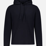 The THEORY Delory Drawstring Hoodie Sweater is a plain black knit top with long sleeves, front pocket, and drawstring hood. Displayed on a white background, it offers a relaxed fit for everyday comfort.