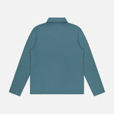 The THEORY Goris Long Sleeve Polo Shirt in teal is displayed flat from the back on a white background. Crafted from lightweight stretch jersey, it delivers both comfort and style.