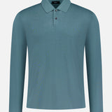 The THEORY Goris Long Sleeve Polo Shirt in teal, made from lightweight stretch jersey with a classic collar and two-button placket, is shown against a plain white background.
