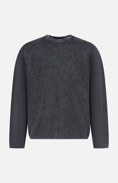 The THEORY Breach Wash Long Sleeve Crewneck Sweater is a dark gray, ribbed lightweight pullover with a round neckline and a simple, casual design, shown on a plain white background. No visible patterns or logos.