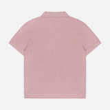 The THEORY Brenan Knit Johnny Collar Polo Shirt is shown from the back in light pink, featuring short sleeves and textured linen-blend fabric, set against a plain white background.