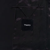 Close-up of the inside of the Chambers Blazer in Stretch Wool by THEORY, revealing a satin lining, an inner pocket with a flap, and a black label with THEORY stitched in white text. This wool sportcoat features refined tailoring and premium details for a polished finish.