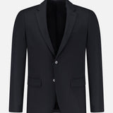 The THEORY Chambers Blazer in Stretch Wool is a black tailored virgin wool blazer featuring notched lapels, a two-button closure, and three front pockets, displayed on a plain white background.