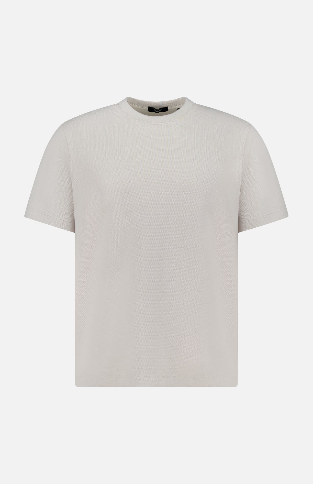 The THEORY Delroy Cotton-blend T-Shirt is a plain, stone-colored short-sleeve tee displayed on a white background. Shown from the front, it features a classic round neckline and has no visible logos or designs. Made from a soft cotton-blend fabric, this comfortable t-shirt is perfect for everyday wear.