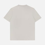 The THEORY Essential Cosmo T-shirt, crafted in Peru from soft organic cotton jersey in light beige, is displayed flat with a back view against a white background.