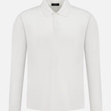 The THEORY Goris Long Sleeve Polo Shirt is a classic plain white top with a collar and two buttons, shown on a white background.
