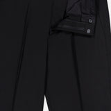 A pair of THEORY Mayer Pant in Stretch Wool in black, featuring a slim fit with the fly open to reveal the zipper, button, and interior waistband details against a plain white background.