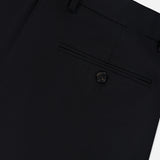 Close-up of the back pocket of the Mayer Pant in Stretch Wool by THEORY, featuring a single welt pocket with button closure and visible belt loops along the waistband. Expertly tailored in a slim fit, these trousers are crafted from luxurious Italian stretch wool suiting for timeless sophistication.