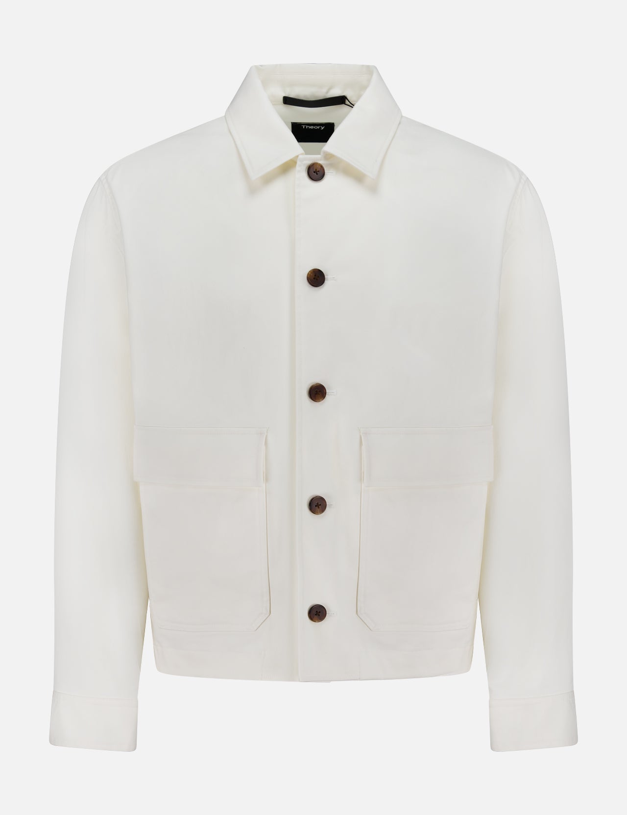 The THEORY Moonsoft Flap Pocket Jacket is an ivory cotton twill long-sleeve outerwear piece with a collar, large front pockets, and dark buttons, shown on a plain white background.