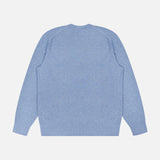 The THEORY Riland Crewneck Sweater in light blue is displayed laid flat on a plain white background, shown from the back. Made from a lightweight stretch knit, this long-sleeve pullover offers breathable comfort.
