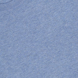 A close-up of the THEORY Riland Crewneck Sweater in light blue, crafted from a breathable knit material, featuring a ribbed crew neckline and a visible black THEORY brand label at the collar.