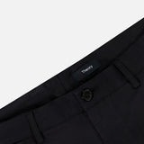 Close-up of the waistband and button on black Standard Chino Moons Shorts by THEORY. Made from smooth cotton twill, these men’s shorts feature belt loops and a tailored, polished look.