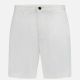 THEORY’s Standard Chino Moons Shorts—white cotton twill with button and zip closure, side pockets, and belt loops—feature a clean, minimal design and are shown on a plain white background.