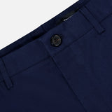 Close-up of the waistband and upper section of RAG & BONE's Standard Moons Shorts, in navy, showing a single black button closure, belt loops, and a partially visible inner label.
