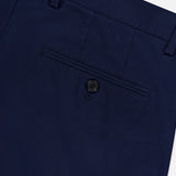 Close-up of the back pocket on RAG & BONE Standard Moons Shorts in navy, showing a single button closure, belt loop, and neatly stitched stretch fabric.