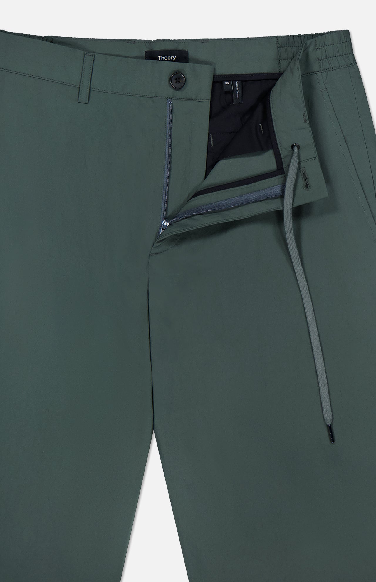 Close-up of THEORY Standard Nylon Drawstring Trouser Pants in dark green, featuring a relaxed fit, zip fly, button closure, elasticized waist with visible drawstring, and a subtle interior THEORY label for a modern look.