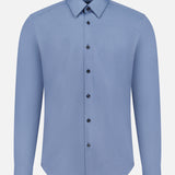 The THEORY Sylvain Structure Dress Shirt, shown in light blue against a plain white background, features a slim fit, long sleeves, and a classic collar. This wrinkle-resistant button-up blends style and practicality for a polished appearance throughout the day.