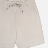 THEORY Terry Drawstring Shorts in beige, featuring an adjustable waist and side pockets, are shown front-facing against a white background. Lightweight fabric offers a casual look ideal for warm weather.