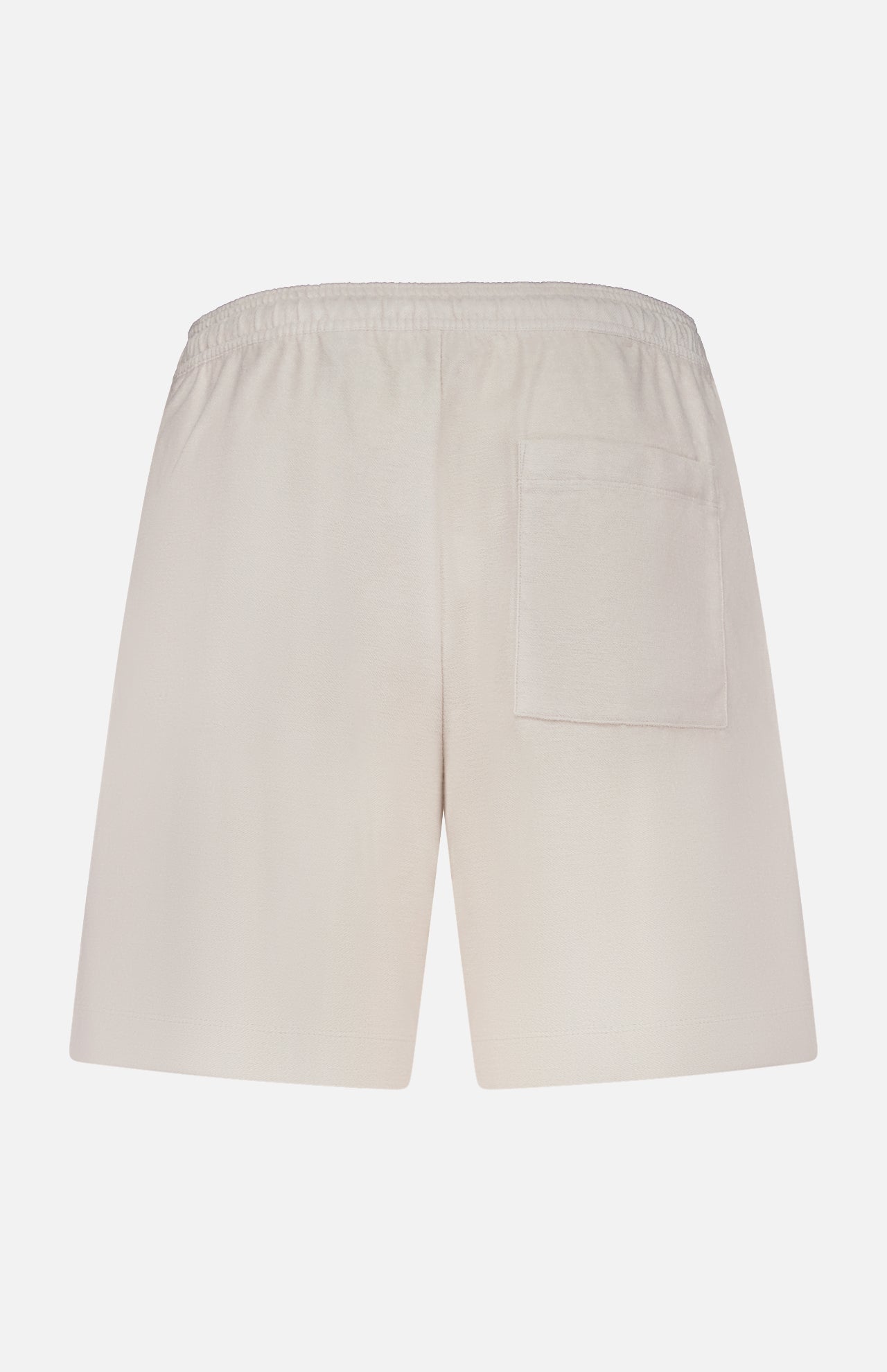 Back view of THEORY Terry Drawstring Shorts in a relaxed beige fit, featuring an adjustable drawstring waist and a single right patch pocket, shown against a plain white background.