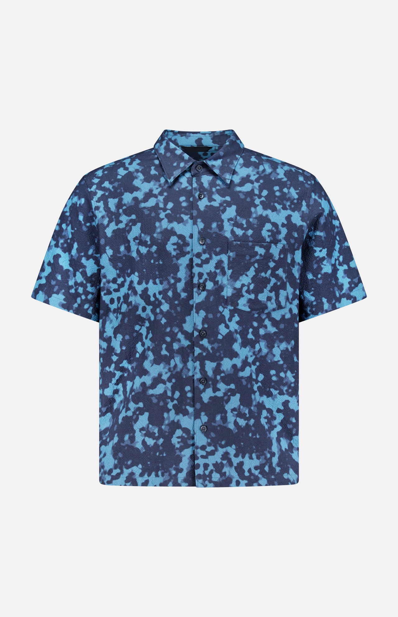 The THEORY Weekend Short Sleeve Shirt features a cotton blend, button-up design with blue and navy abstract camouflage pattern and a left chest pocket, shown on a plain white background.