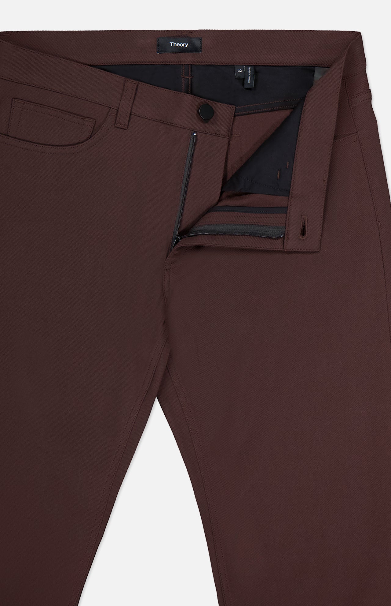 Close-up of THEORY's Raffi Stretch Twill Pants in dark brown, featuring a slim fit, partially open front zipper and button, visible waistband and interior details, a small front pocket, belt loops, and comfortable 4-way stretch fabric.