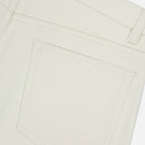 Close-up of the back pocket on THEORY Raffi Stretch Twill Pants in an oat milk shade, showing detailed stitching and the texture of their 4-way stretch fabric.