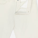 The THEORY Raffi Stretch Twill Pants in oat milk feature a slim fit, visible zipper, button closure, front pocket, and belt loops, shown partially unzipped to highlight the interior waistband and label.