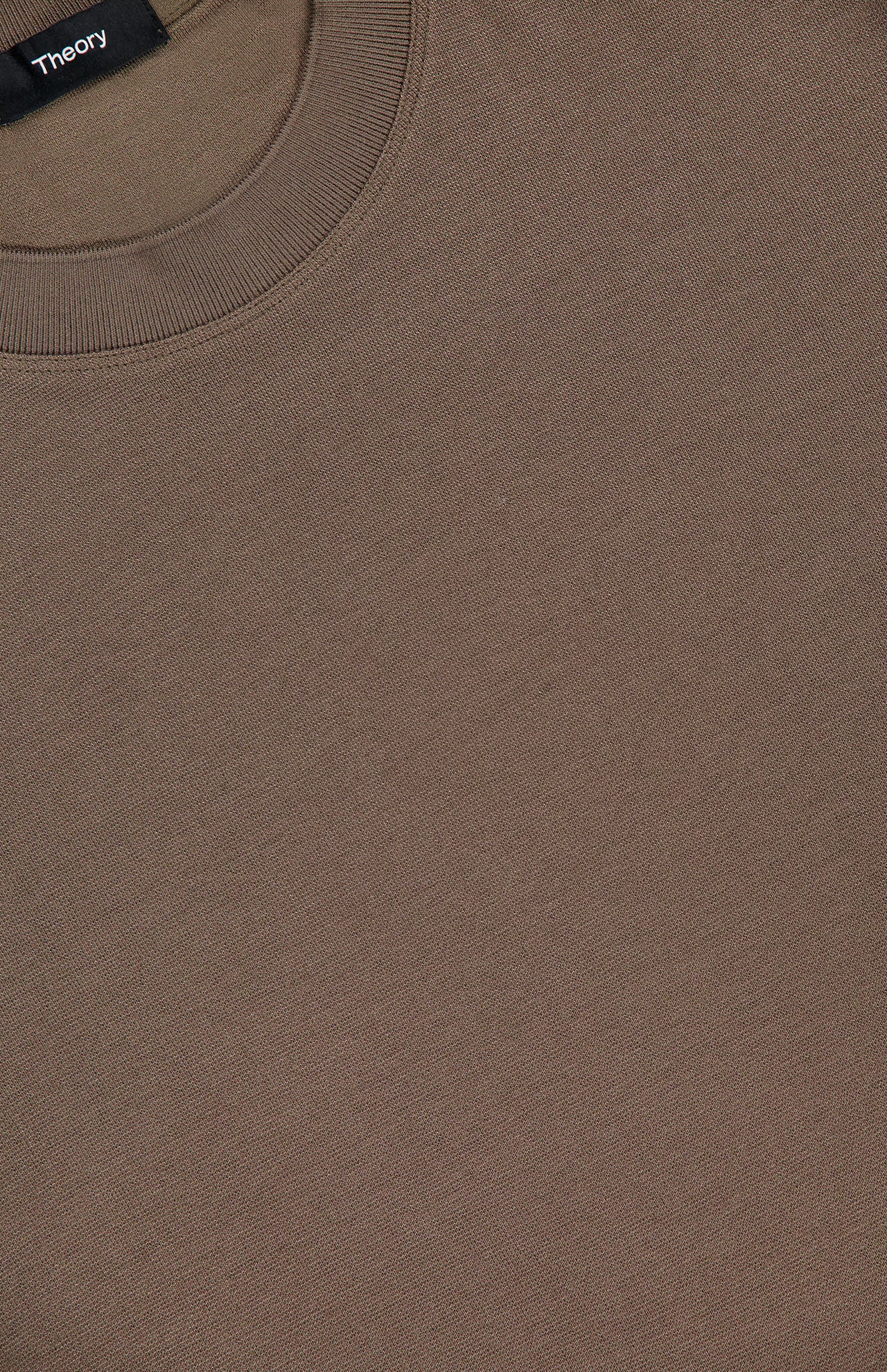 Close-up of a dark brown THEORY Sarior Stretch T-shirt in fine, lightweight stretch jersey. This classic fit features a ribbed collar and displays part of the black THEORY label at the neckline.