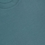 A close-up of the Sarior Stretch T-shirt by THEORY shows the inside collar label, highlighting its stretch jersey fabric and precise stitching.