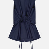 THEORY's 3 Button Sleeveless Vest in navy blue features a back view with a cinched waist and adjustable drawstring ties, complemented by a flared hem—ideal for summer office style.