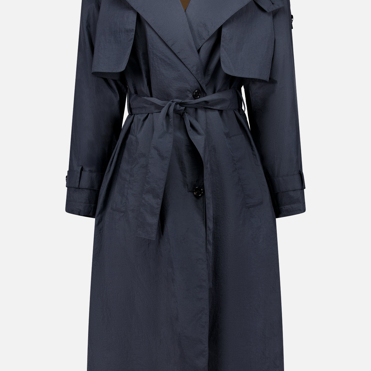 THEORY’s Airy Nylon Trench Coat, a dark blue knee-length double-breasted design with a belted waist, wide lapels, button closure, front flap pockets, and long sleeves, is shown against a plain white background.