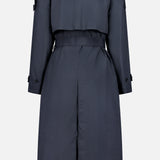 THEORY's Airy Nylon Trench Coat in dark navy features a double-breasted design, storm flap, belted waist, long sleeves with buttoned straps, and a center back vent—an essential piece for any capsule wardrobe.