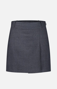 THEORY Aline Pleated Mini Skirt in dark gray, featuring a knee-length silhouette with belt loops and a subtle front fold, displayed on a plain white background.