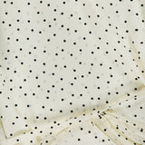 The THEORY Polka Dot Belted Scoop Neck Top features chic cream fabric with small black polka dots and a slim, matching belt, making it a stylish sleeveless blouse ideal for office wear.