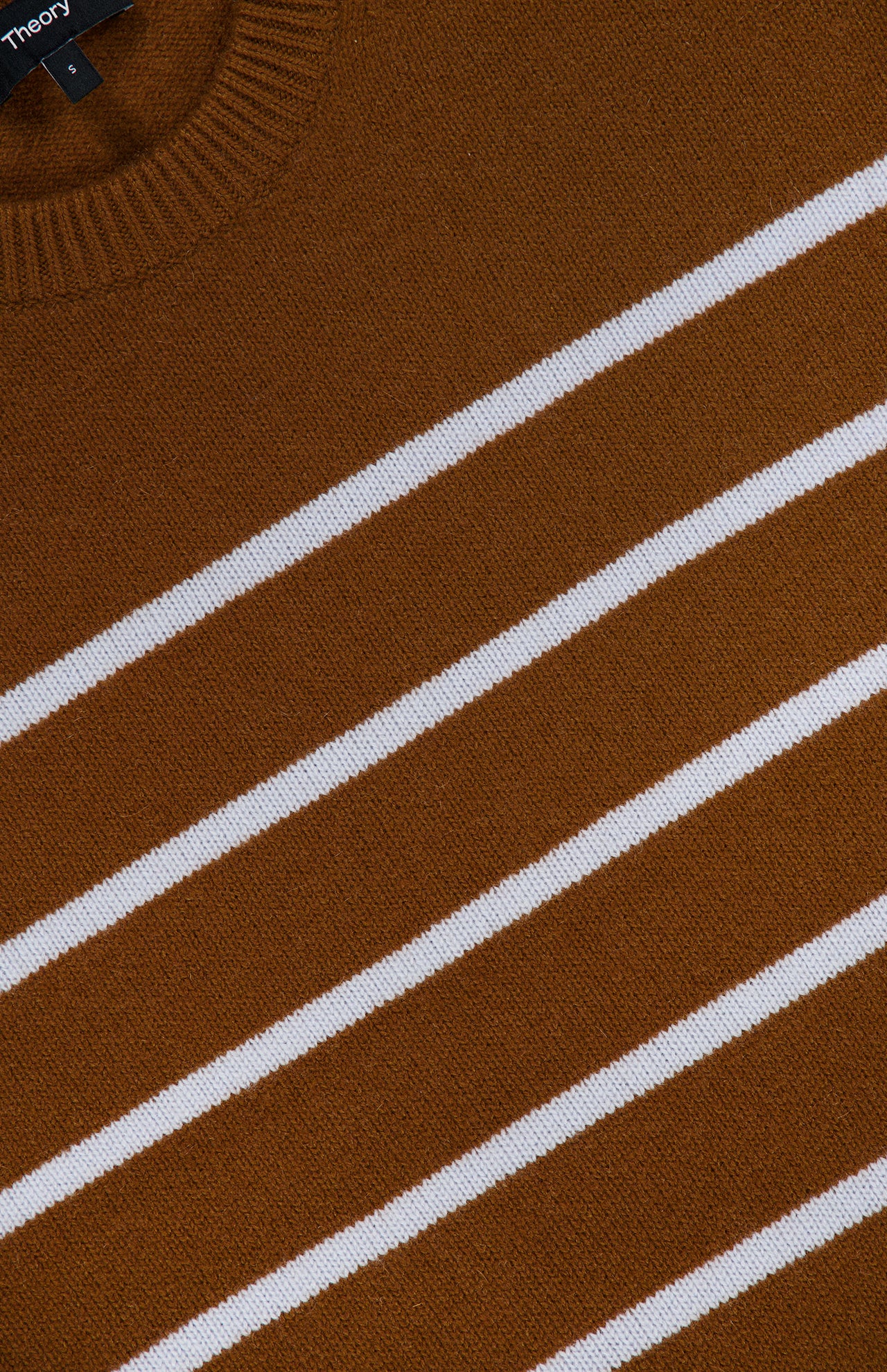 Close-up of the THEORY Cashmere Crewneck Pullover Sweater in brown, featuring evenly spaced horizontal white stripes. The fabric looks soft, with the ribbed collar of this striped pullover partially visible in the top left corner.
