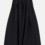The THEORY Curved Yoke Circle Skirt is a black, high-waisted A-line midi with gathered detailing, an elastic waistband, and a pull-on design, shown against a plain white background.