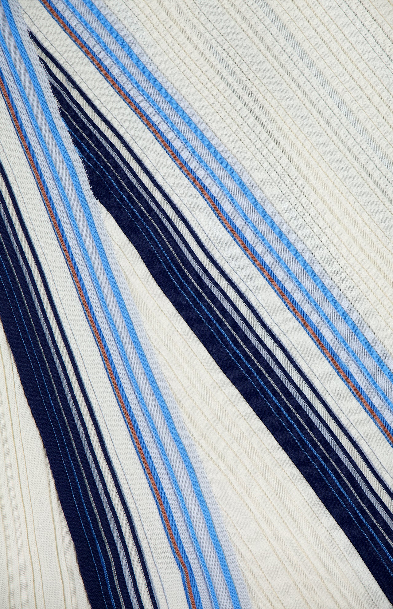 The DRAPE NECK STRIPE TANK DRESS by THEORY showcases an abstract pleated cream fabric accented with diagonal navy blue, sky blue, and fine red stripes. This dynamic interplay of colors and textured folds elevates the classic tank dress silhouette, capturing the movement and structure reminiscent of a fit-and-flare style.