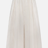 The THEORY Front Vented Volume Striped Skirt is a cream A-line midi skirt with neutral vertical stripes, crafted from a soft cotton blend. It features a high waistband and elegant pleats for classic style.