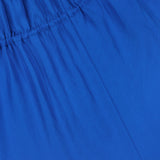 Close-up of the Gathered V-Neck Dress by THEORY in electric blue, featuring gathered elastic stitching near the top that creates soft vertical folds and a slightly textured, wrinkled appearance. The stretchy elastic waistband ensures enhanced comfort and fit.