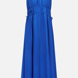 The THEORY Gathered V-Neck Dress is a sleeveless, electric blue piece with thin spaghetti straps, featuring a stretchy elastic waistband with side ties, convenient side slit pockets, and a loose, flared skirt. The dress is displayed against a plain white background.