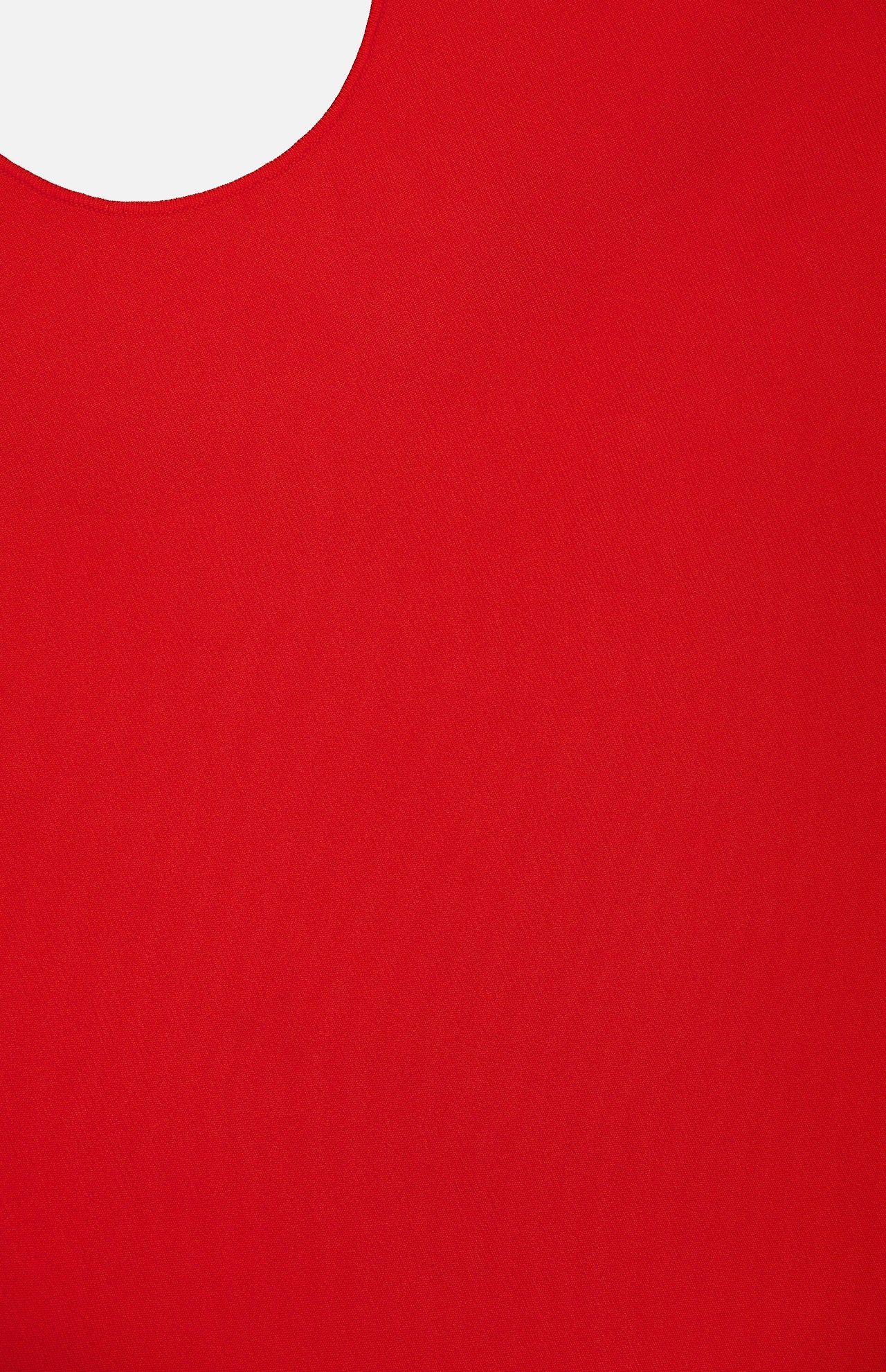 A close-up of the THEORY Halter Neck Tank Top in vibrant red shows its smooth, sleeveless fabric and a curved cutout at the top left, revealing a white background.