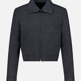 THEORY’s Harrington Cropped Jacket is a women’s dark gray, long-sleeve charcoal jacket featuring a modern cropped fit, front zipper closure, pointed collar with snap button details, and straight cuffs. Crafted from a wool-blend fabric, this versatile office-ready jacket delivers stylish sophistication for any wardrobe.