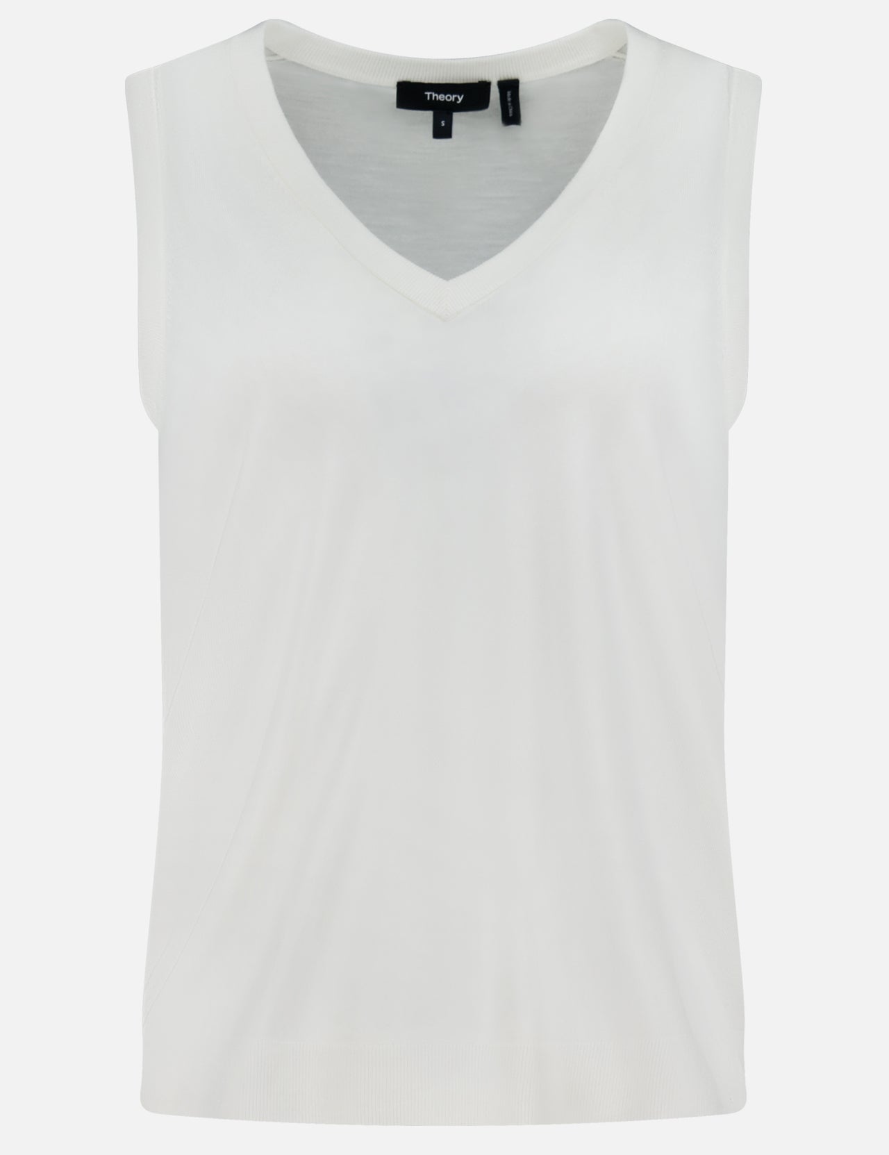 The THEORY Merino Slim Tank Top is a sleeveless white piece with a relaxed V-neck fit, made from smooth, lightweight Merino wool and showcases a simple, minimalist design.