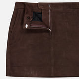 A chocolate brown lamb leather mini trouser skirt from THEORY, featuring side pockets, a partially unzipped front closure that reveals a black inner lining, and finished with a button at the waistband.