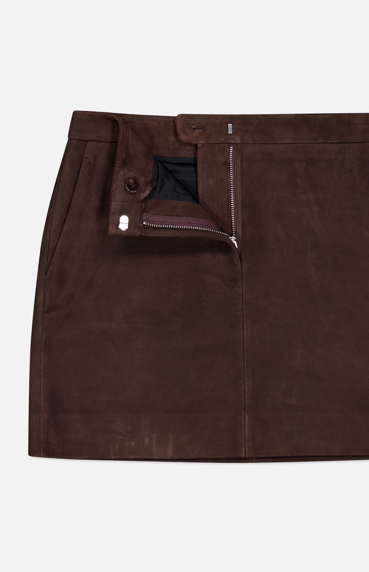 A chocolate brown lamb leather mini trouser skirt from THEORY, featuring side pockets, a partially unzipped front closure that reveals a black inner lining, and finished with a button at the waistband.