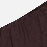 Close-up of THEORY’s Pintuck Pull-On Pant in brown, featuring a textured fabric and an elastic waistband, photographed against a white background. This pull-on design offers ease and comfort for everyday wear.