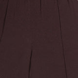 Close-up of the upper section of the THEORY Pintuck Pull-On Pant in brown, showcasing an elastic waistband and subtly textured fabric. The pull-on design offers ease and comfort, while the relaxed fit enhances everyday wearability.